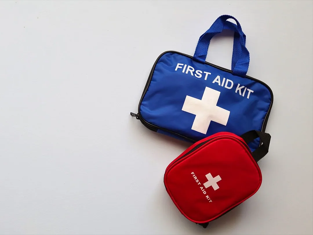 Two first-aid kits on white
